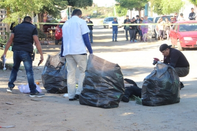 Entre bultos de basura dejan a un joven asesinado a golpes en la colonia La Costera, Culiacán